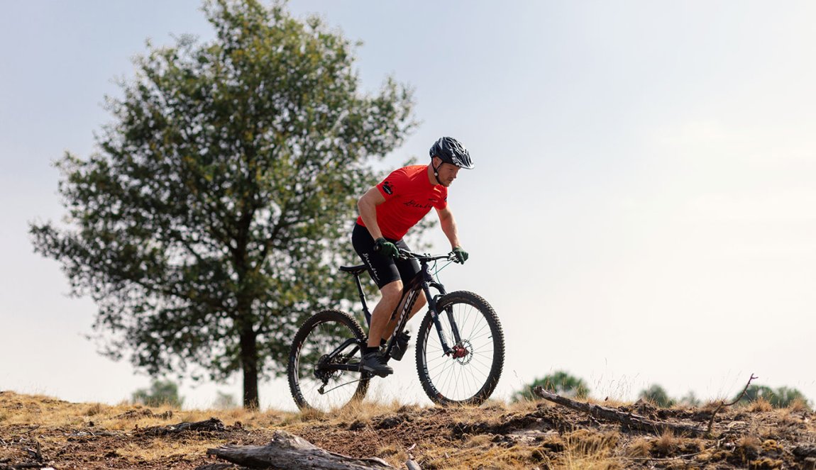 Cyclist on a mountainbike in Drents-Friese Wold Cyclist on a mountainbike in Drents-Friese Wold
