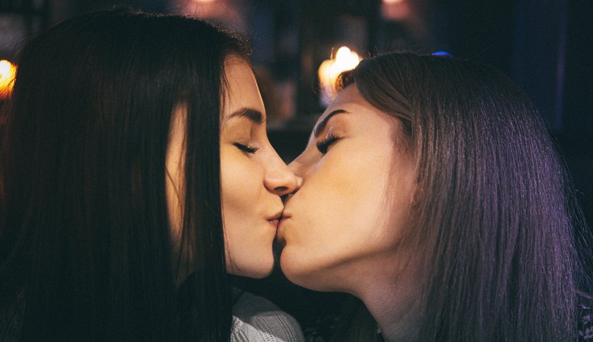 Women with brown hair kissing Women with brown hair kissing