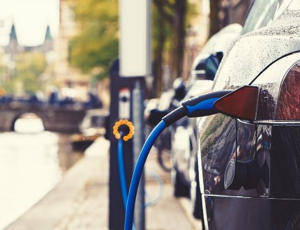 Electric car charging in the street of Amsterdam Electric car charging in the street of Amsterdam