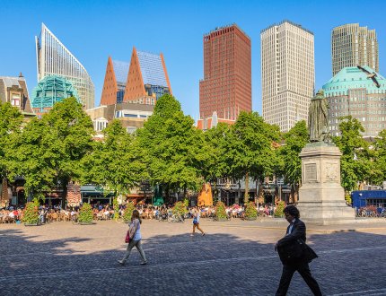 Strollers on the Plein with The Hague skyline in the background Strollers on the Plein with The Hague skyline in the background