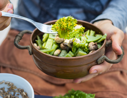 Green greens in a bowl with fork. Vegan vegetarian healty food . Green greens in a bowl with fork. Vegan vegetarian healty food .