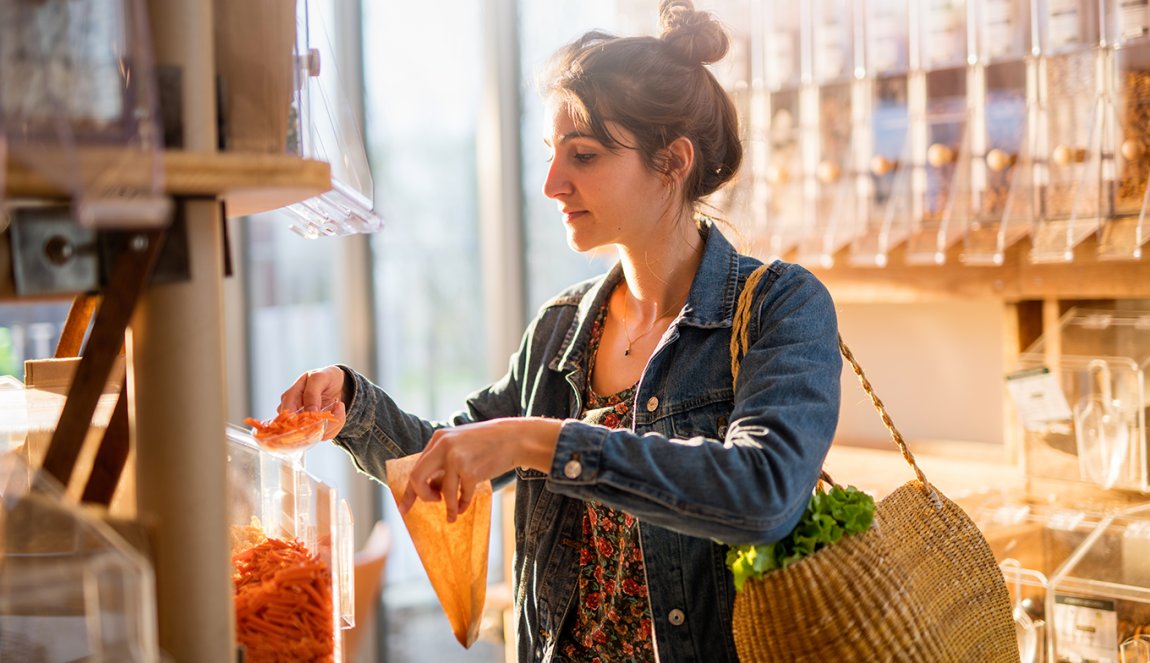 Young woman shopping in a bulk store Young woman shopping in a bulk store
