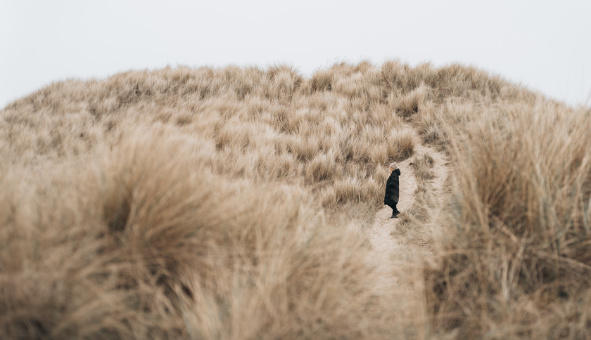 Woman standing in the dunes Woman standing in the dunes